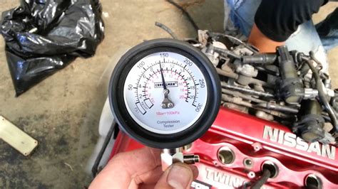 performing a compression test|auto engine compression tester.